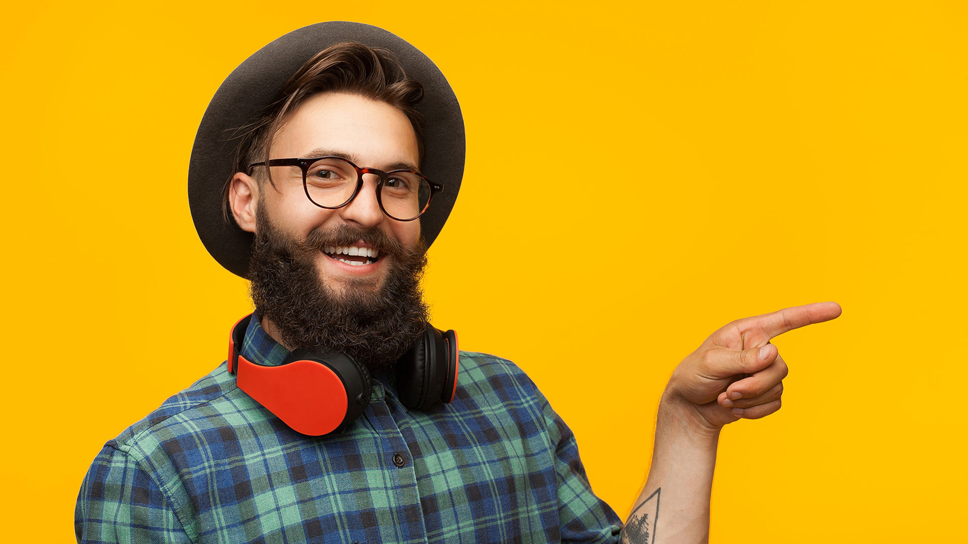 A young man with a hat and headphones