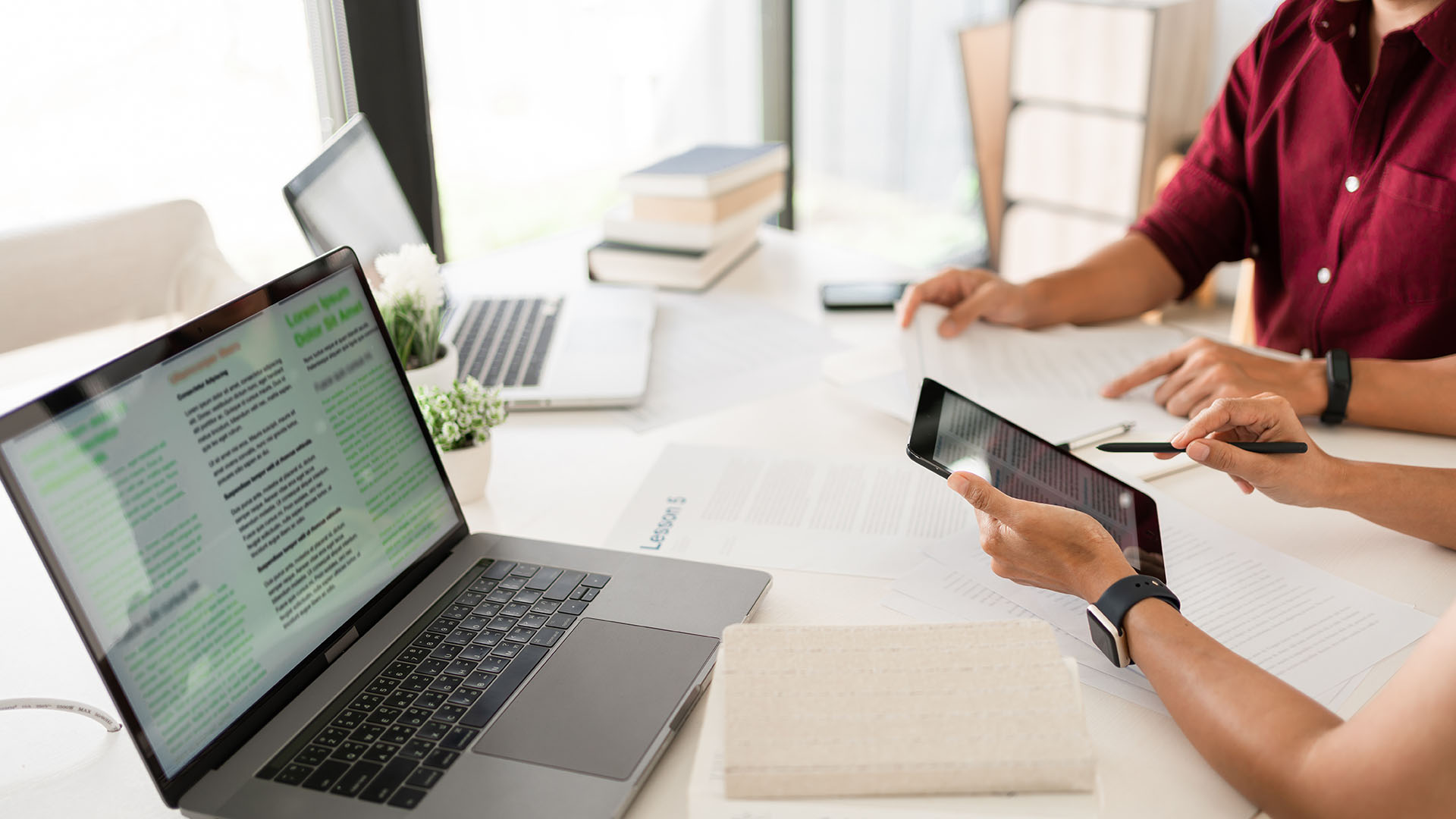 Two students studying on mobile devices
