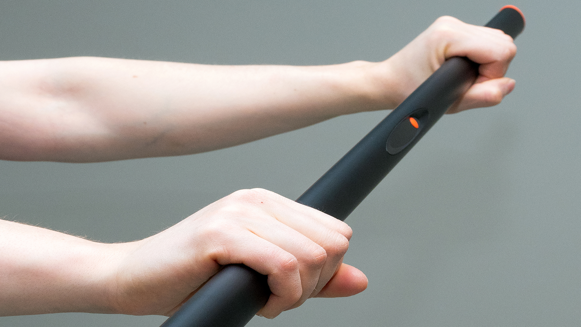 Person holding TE3 stick in her hands