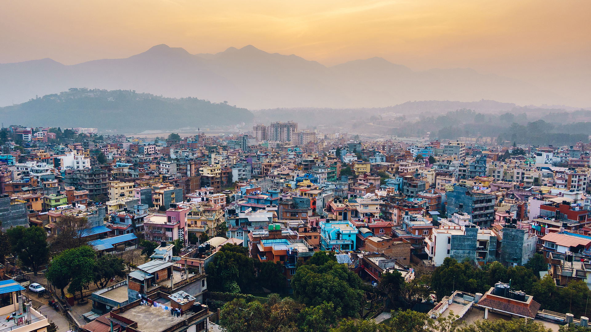 Kathmandu city view with mountains by sunset