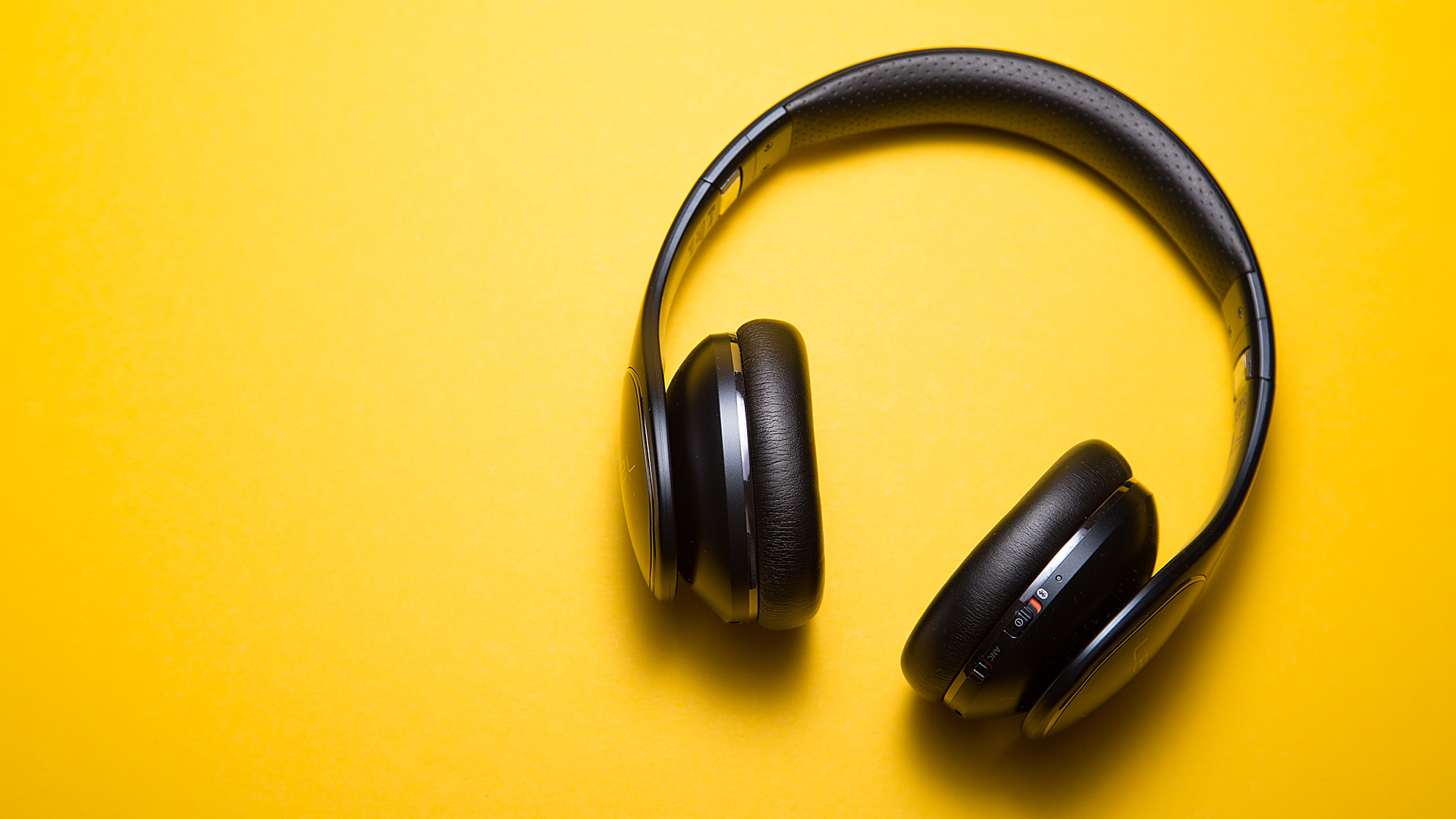 Headphones on a yellow background