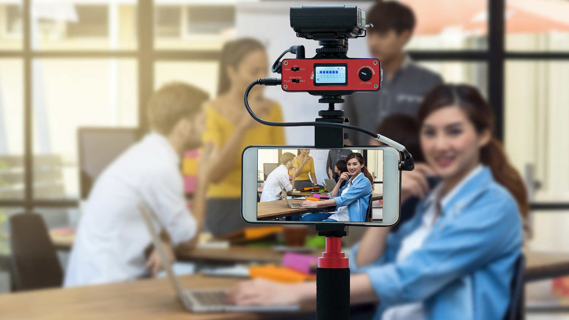 Four people shooting video in a meeting
