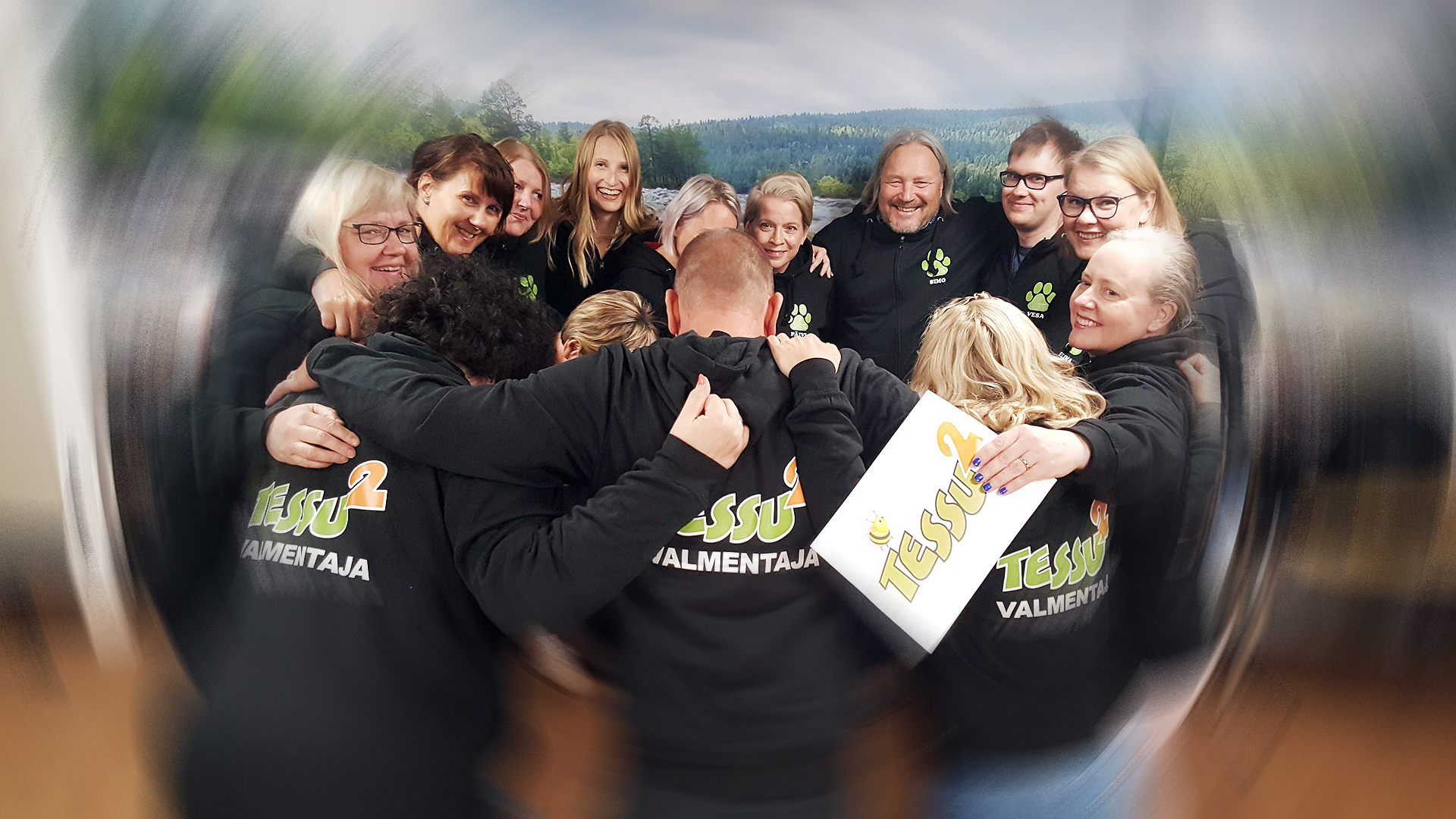Happy project workers group hugging