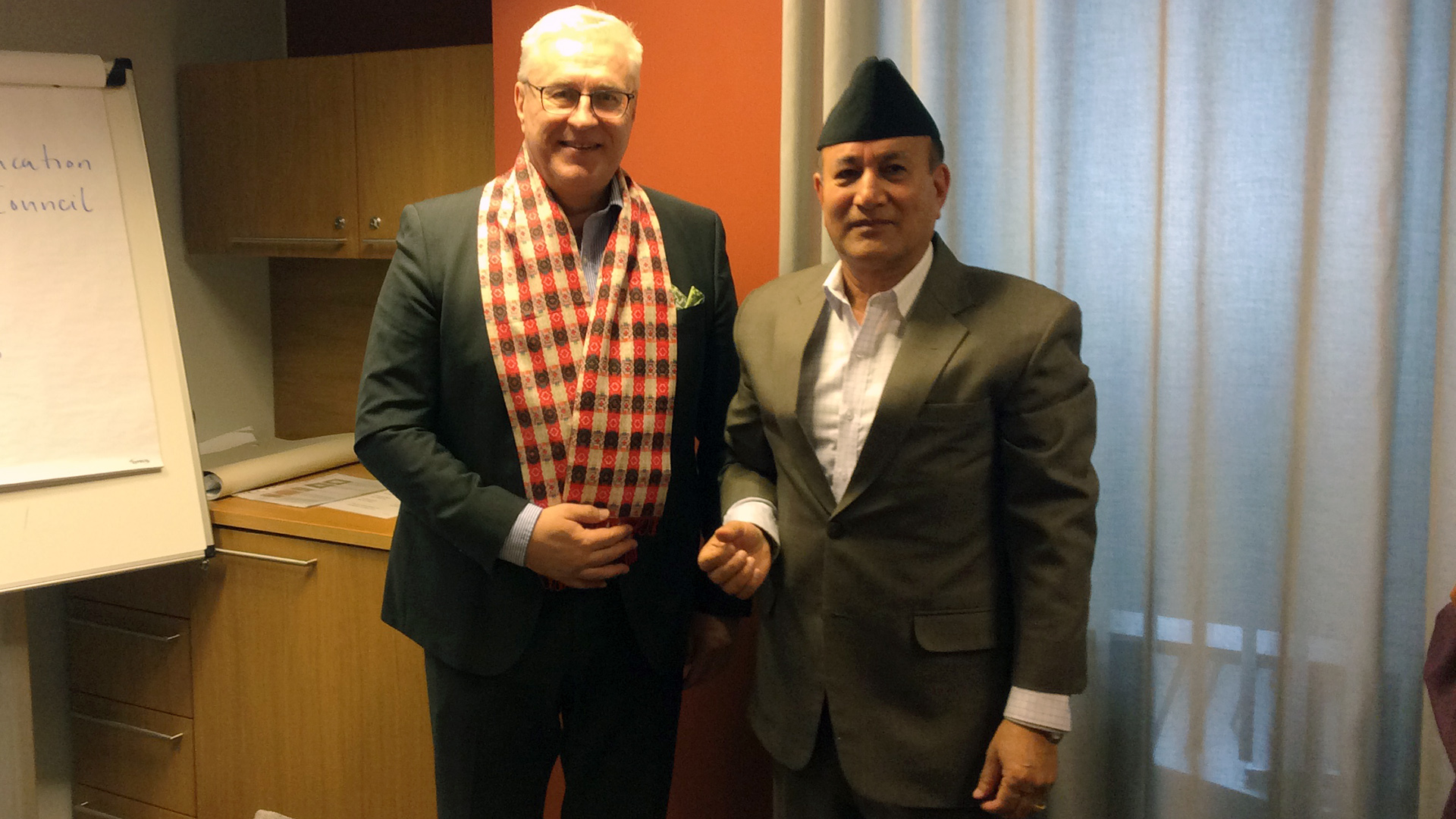 Dr. Arbinda Lal Bhomi with vice rector Malinen standing.