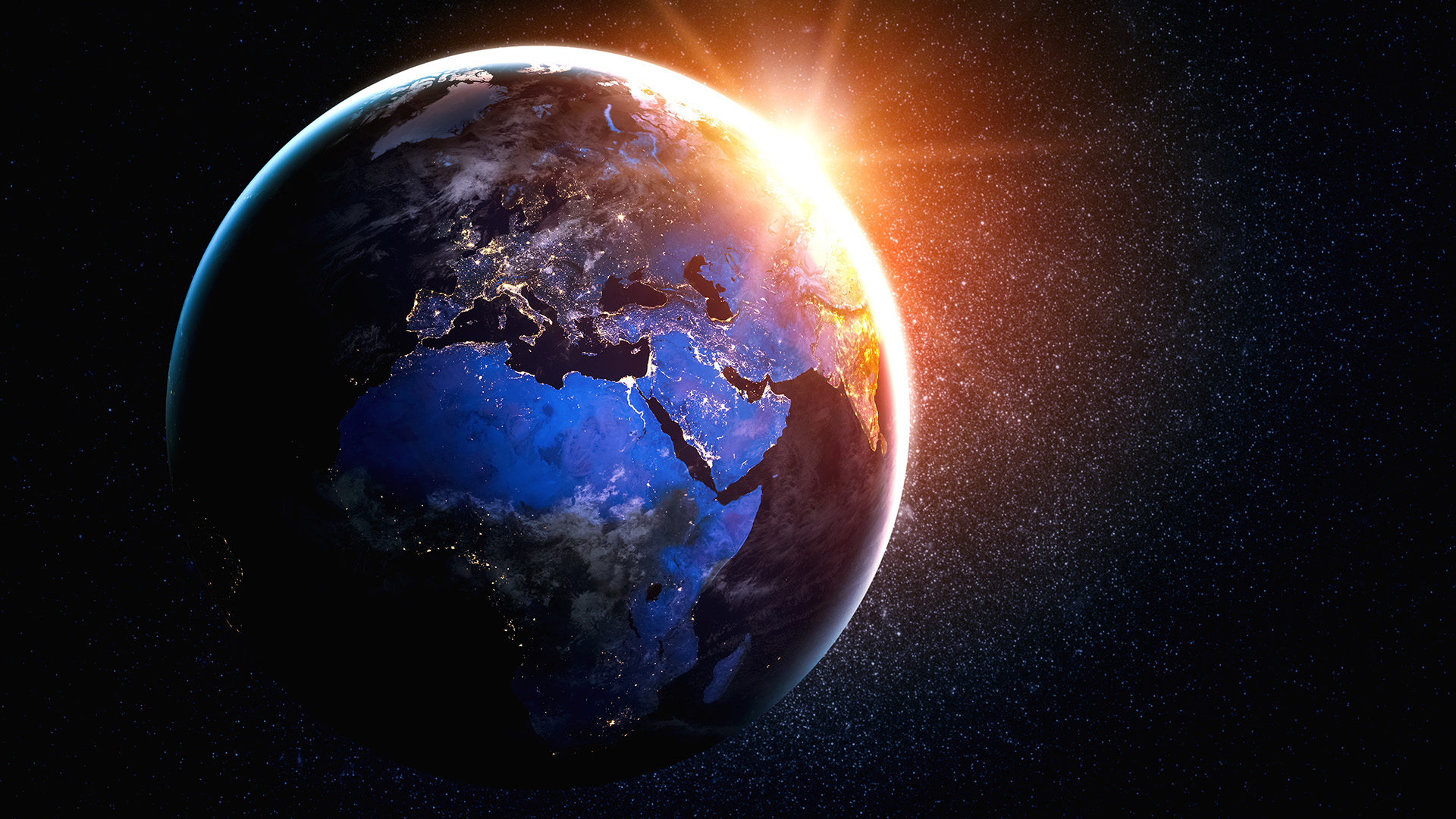 Maapallo avaruudesta kuvattuna auringonnousun aikaan