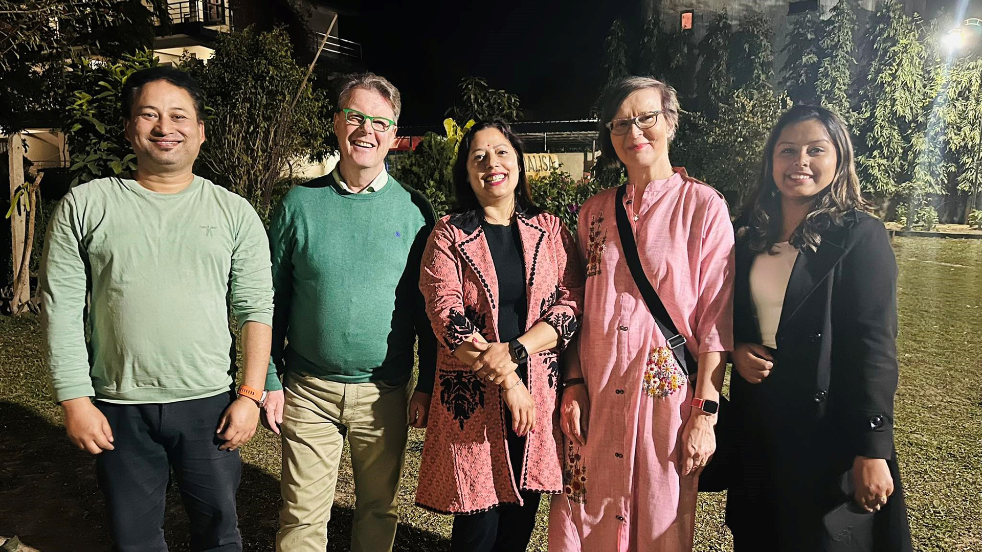 Project experts standing and smiling