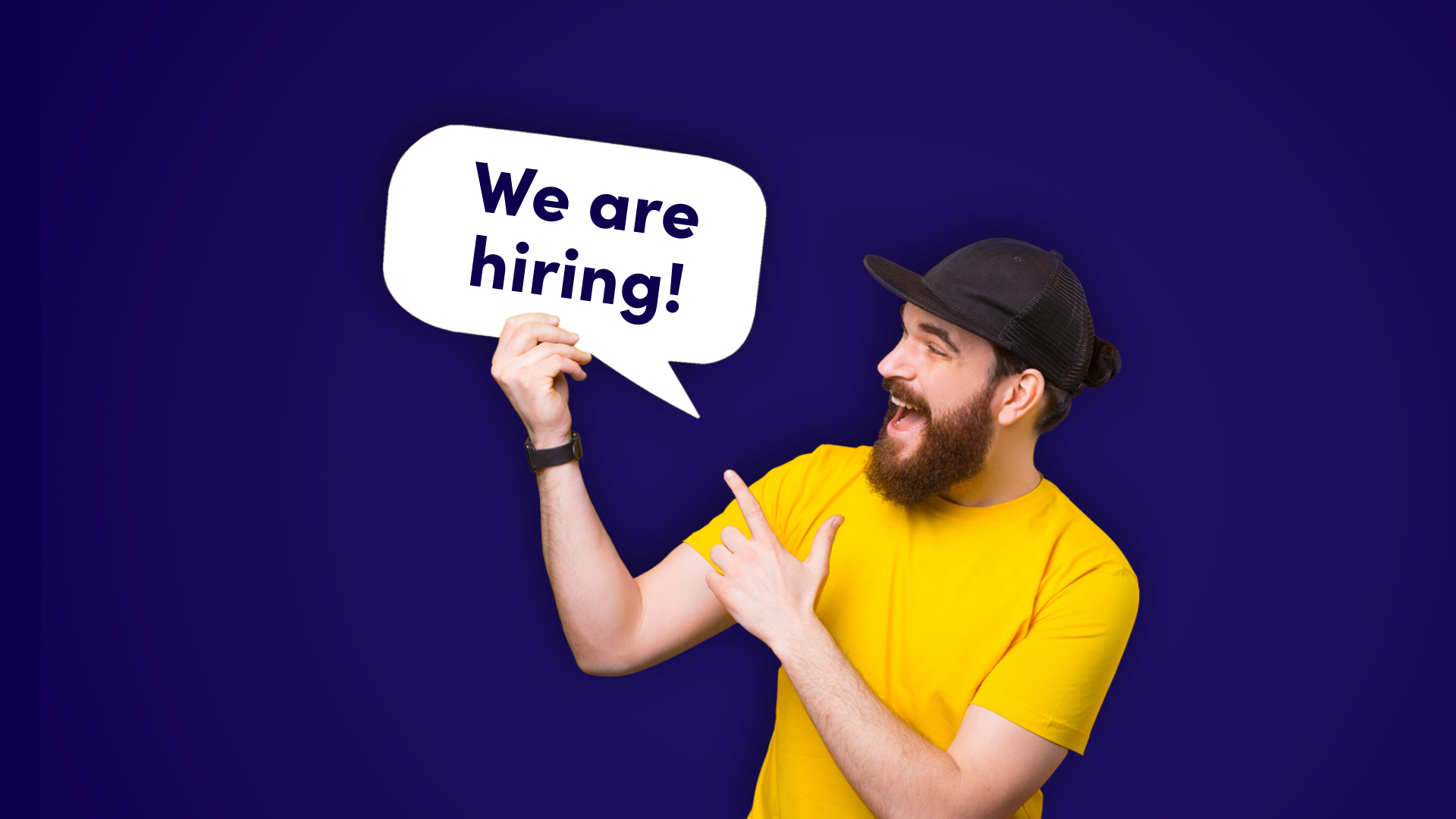 Nuori mies ja kyltti "We are hiring"