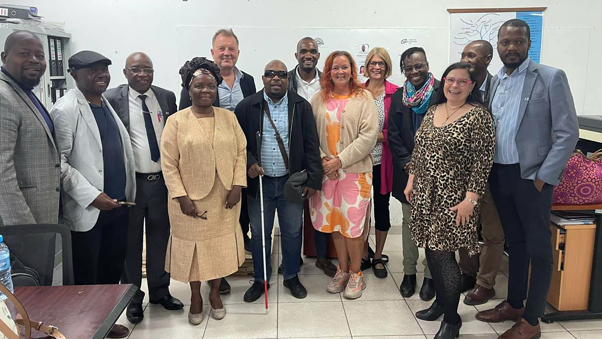 13 people in a group photo, the Project Advisory Committee