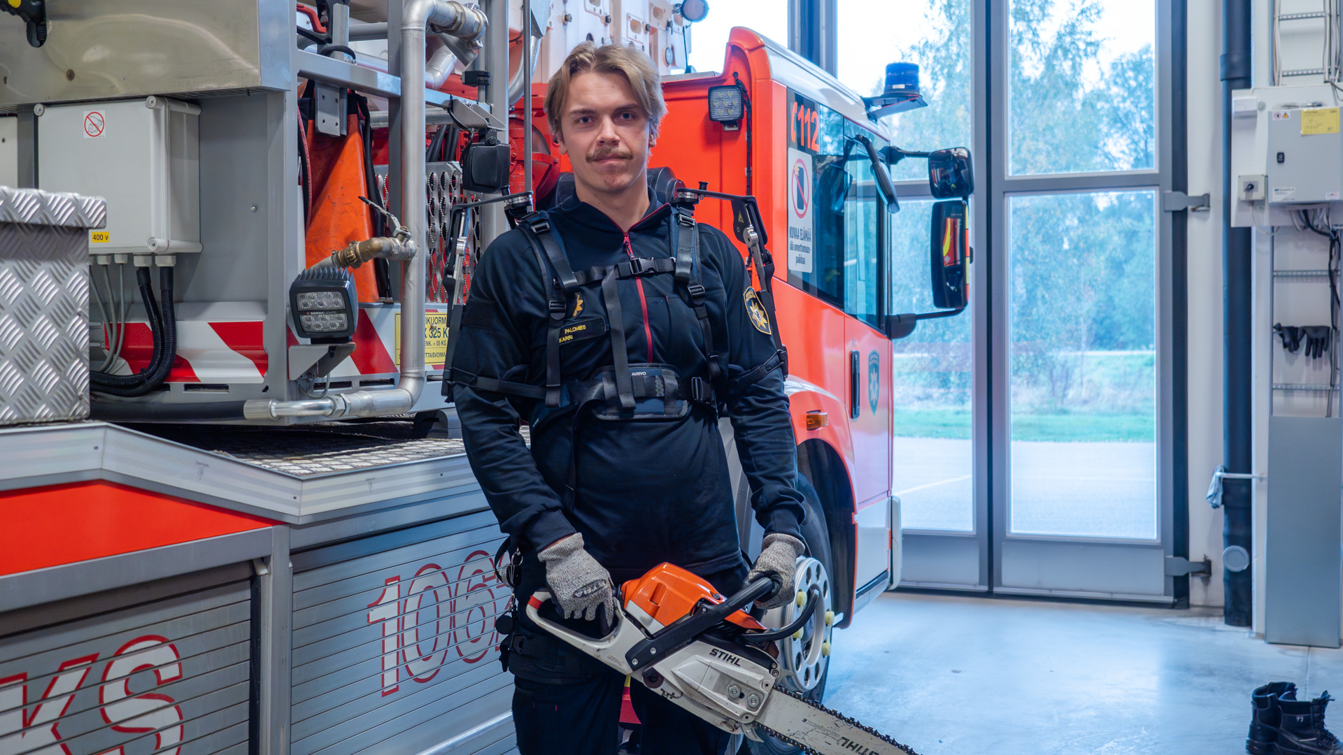 A firefighter wearing an exoskeleton.