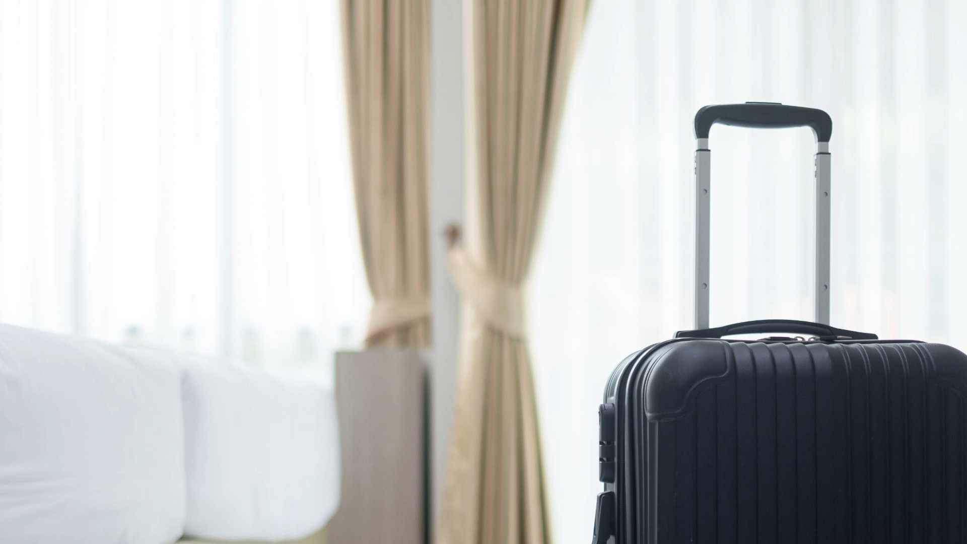 Suitcase in a hotel room