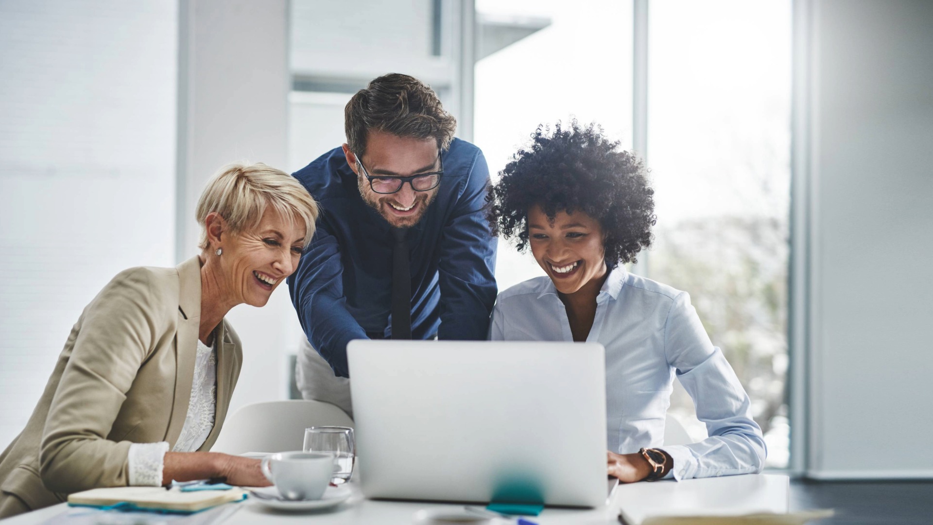 Three people writing together