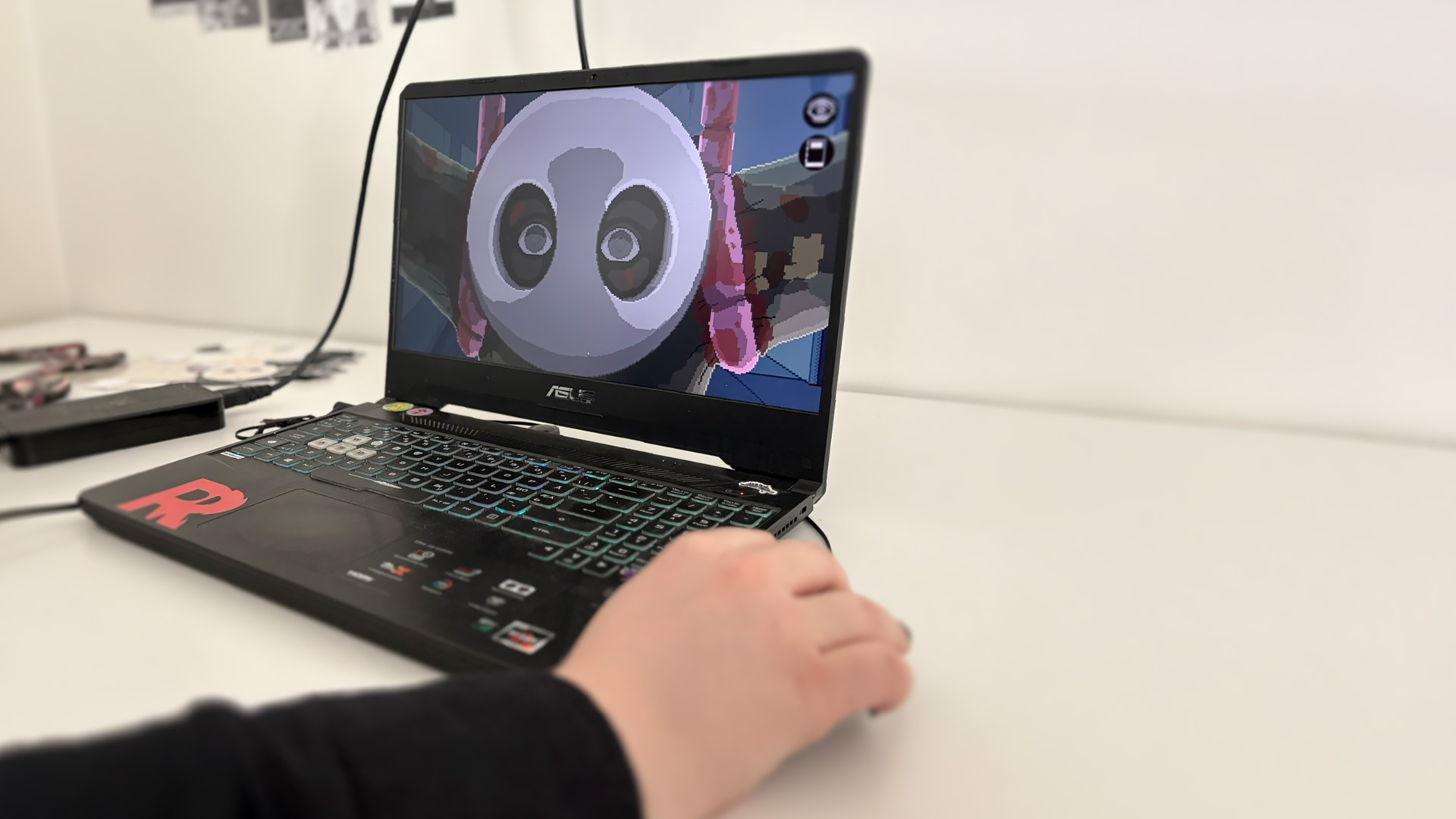 Game devs presenting their demo gameplay from a computer screen.