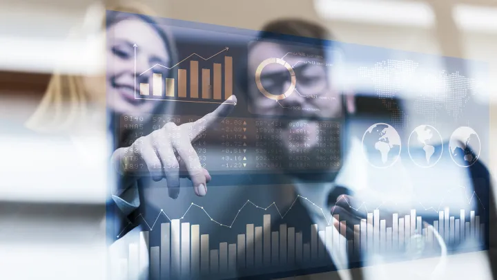 Woman and a man checking data on glass screen