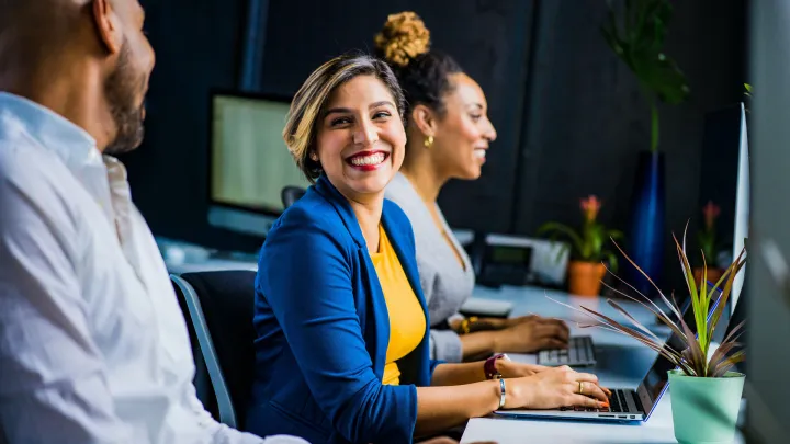 People working together with laptops
