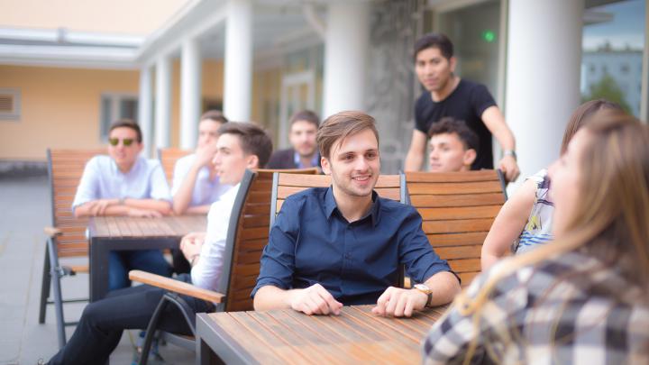 Students sitting on a terrace