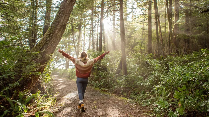 A woman walking in the woods