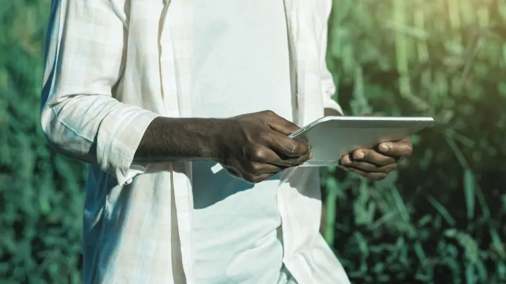 person holding a tablet device