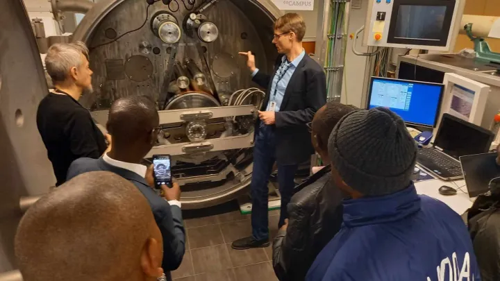 people watching a person showing them a device