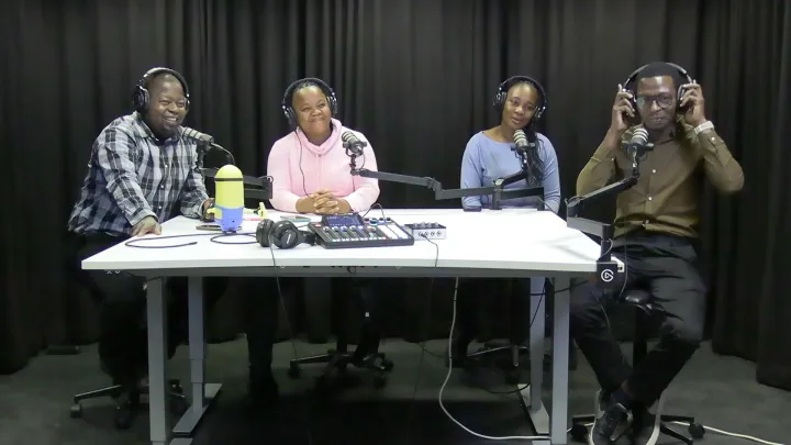 Four TIPOTE experts in a studio recording podcast